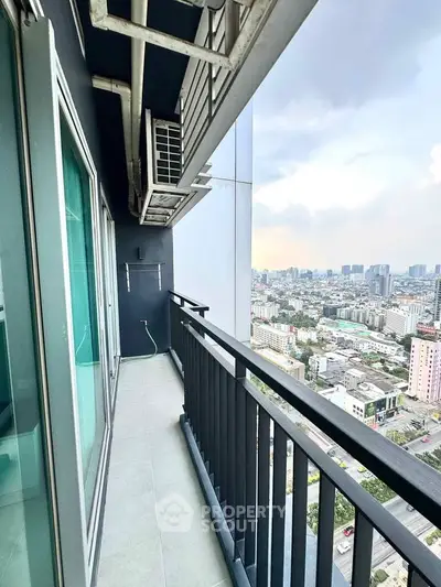Stunning high-rise balcony with panoramic city views and modern railing design.