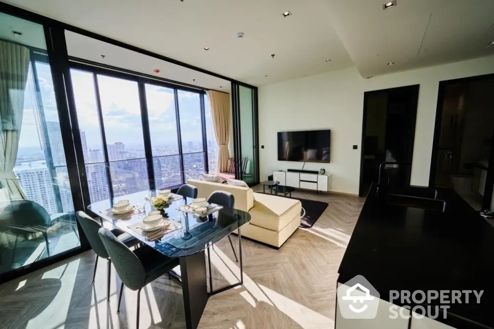 Luxurious high-rise living room with panoramic city views and modern furnishings.