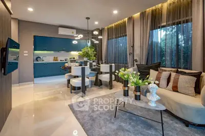 Modern open-layout living room with stylish decor and elegant kitchen area.