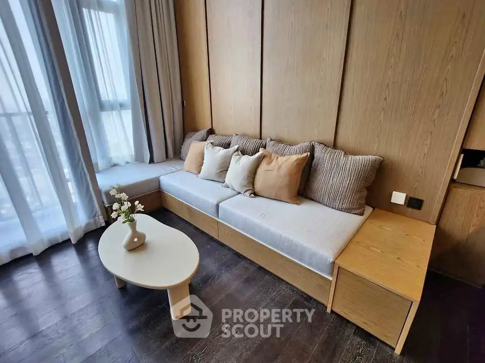 Modern living room with stylish wooden paneling and cozy seating area