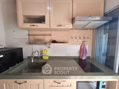 Modern kitchen with sleek cabinetry and electric cooktop