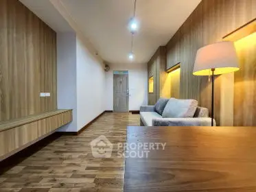 Modern living room with wooden flooring and stylish lighting