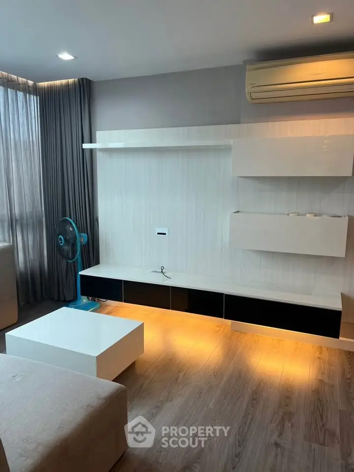 Modern living room with sleek furniture and ambient lighting