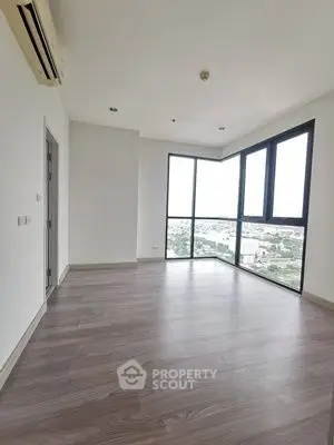 Spacious corner unit with large windows offering stunning city views