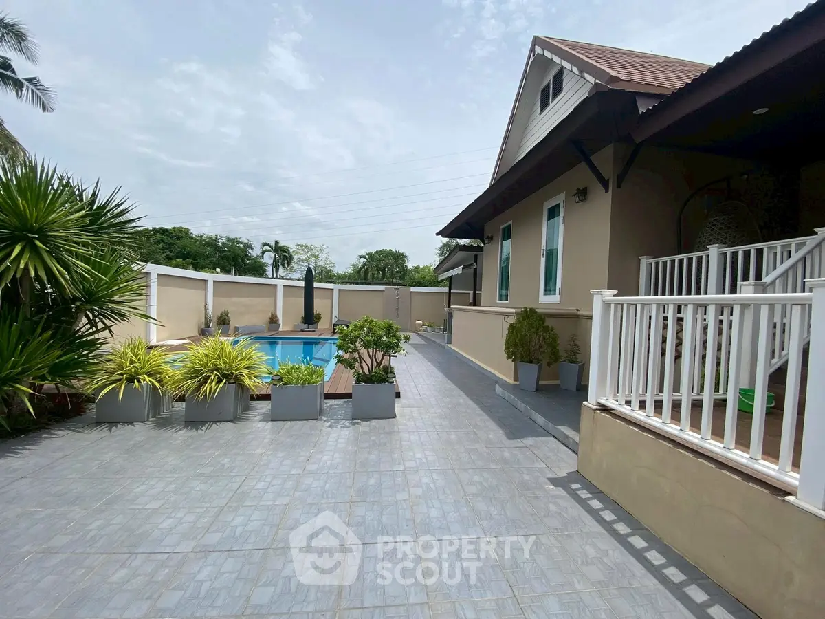 Charming home with spacious patio and inviting pool, perfect for outdoor relaxation and entertaining.