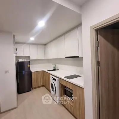 Modern kitchen with sleek cabinetry and built-in appliances