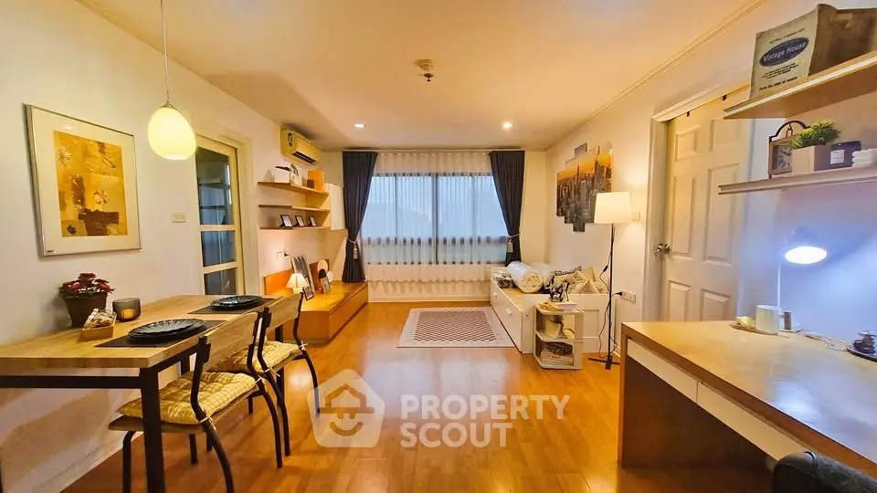 Charming living room with warm lighting and stylish decor, perfect for relaxation and entertaining.