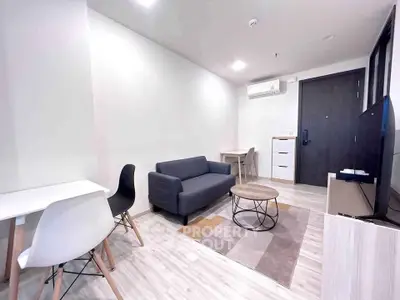 Modern living room with sleek furniture and neutral tones, perfect for urban living.