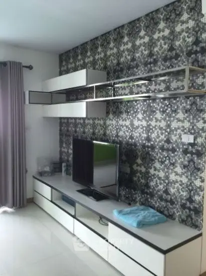 Modern living room with stylish TV unit and patterned accent wall