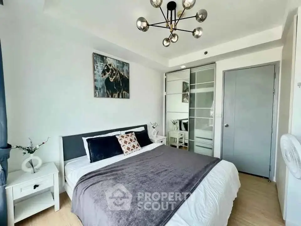 Modern bedroom with stylish decor and ample natural light