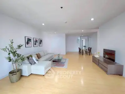 Spacious modern living room with elegant decor and open layout, perfect for family gatherings.