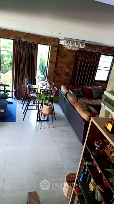 Spacious living room with modern decor and large windows for natural light