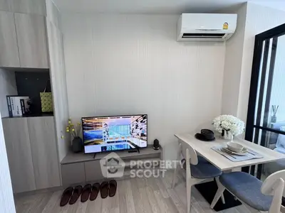 Modern living room with sleek furniture and air conditioning, perfect for urban living.