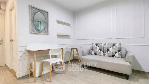 Modern living room with stylish decor and comfortable seating in a cozy apartment.
