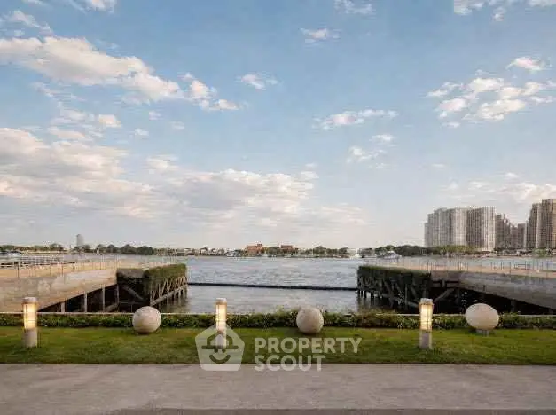 Stunning waterfront view with modern cityscape and lush greenery, perfect for luxury living.