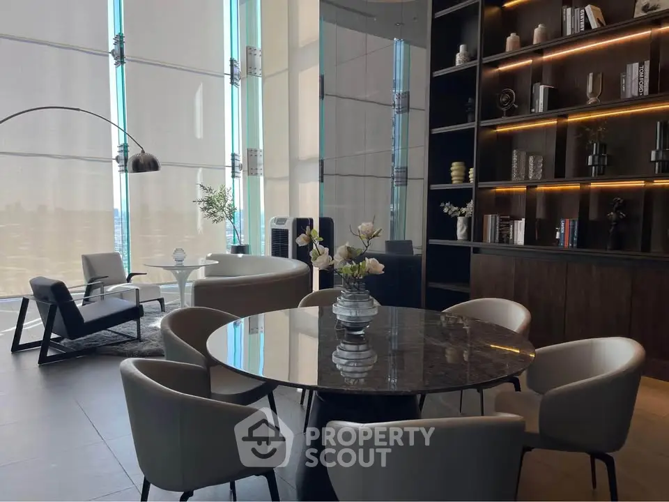Luxurious modern living room with elegant furniture and floor-to-ceiling windows