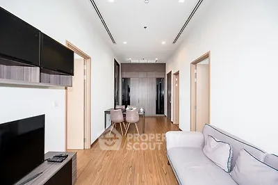 Modern living room with sleek furniture and wooden flooring