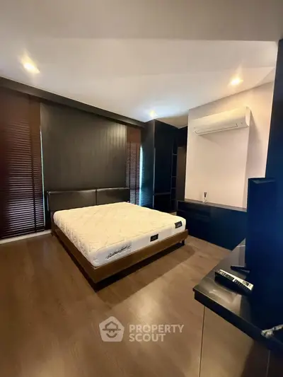 Modern bedroom with sleek design and air conditioning unit