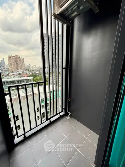 Modern high-rise balcony with city view and sleek design