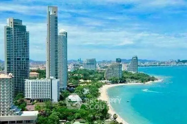 Stunning beachfront high-rise buildings with panoramic ocean views in a vibrant coastal cityscape.