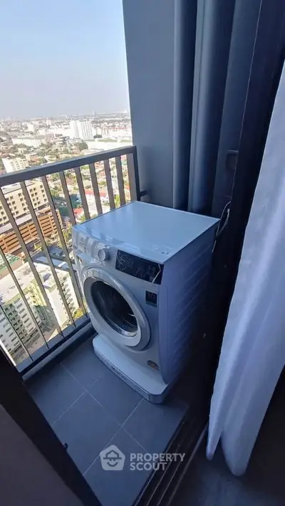 High-rise balcony with washing machine and city view, perfect for urban living convenience.
