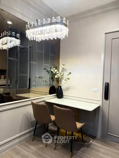 Elegant dining nook with modern chandelier and stylish decor