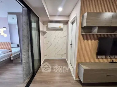 Modern apartment interior with stylish wood paneling and sleek TV setup