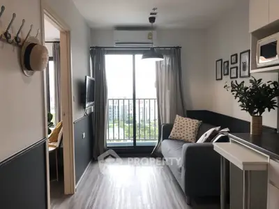 Modern living room with balcony view, stylish decor, and natural light.