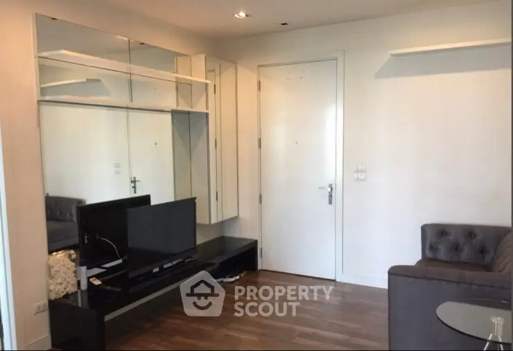 Modern living room with stylish furniture and sleek design, perfect for urban living.