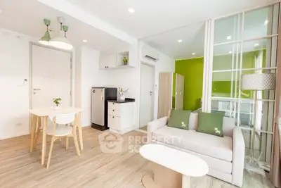 Modern living room with open layout, stylish furniture, and bright decor in a contemporary apartment.