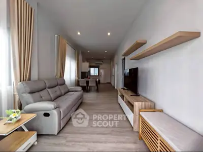 Spacious modern living room with sleek furniture and natural light