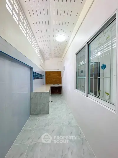 Modern kitchen with sleek design and ample natural light