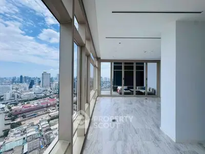 Stunning high-rise apartment with panoramic city views and spacious open layout.