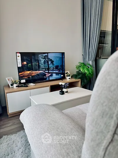 Modern living room with cozy sofa and stylish TV setup