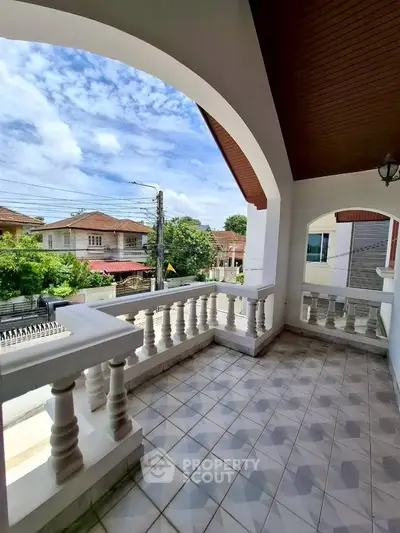 Spacious balcony with elegant balustrades and scenic neighborhood view