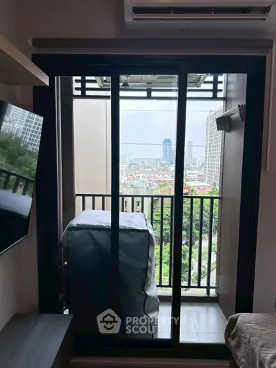 Charming apartment balcony with city view, perfect for relaxation and enjoying the skyline.