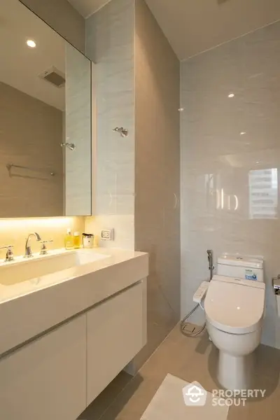 Modern bathroom with sleek fixtures and elegant lighting