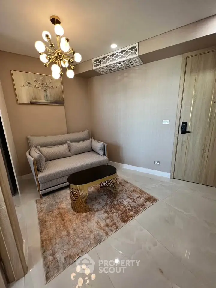 Elegant living room with modern chandelier and stylish sofa