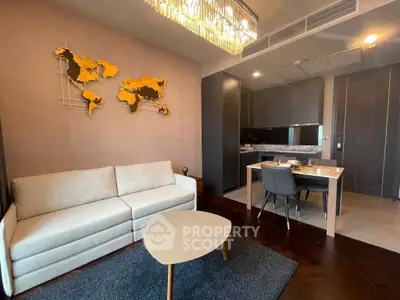 Modern living room with stylish decor and open kitchen layout in a contemporary apartment.