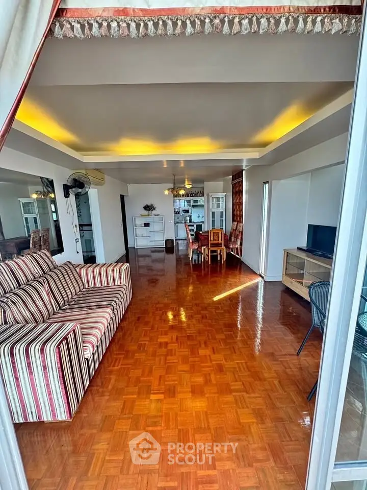 Spacious living room with elegant decor and parquet flooring in modern apartment