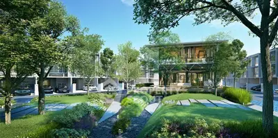 Luxurious modern residential complex with lush greenery and elegant architecture.