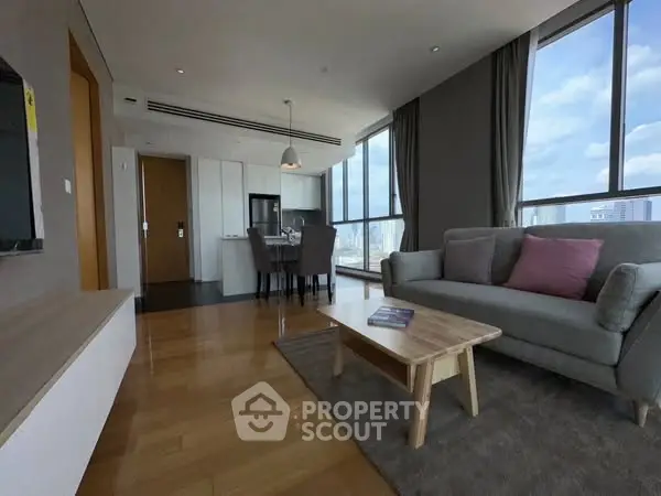 Spacious modern living room with city view and open kitchen layout