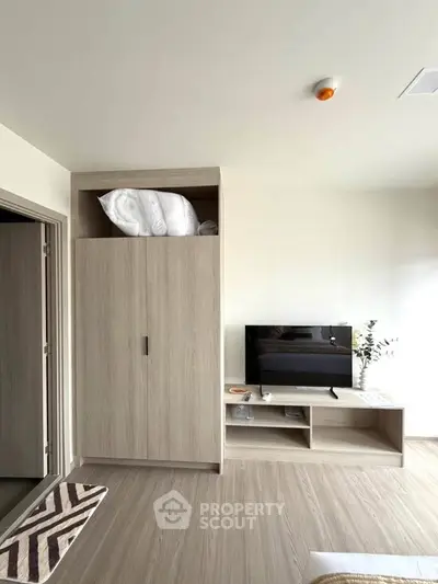 Modern living room with sleek TV stand and built-in storage cabinets