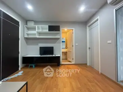 Modern living room with wooden flooring and sleek furniture design
