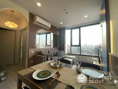 Modern living room with city view, stylish decor, and dining area in high-rise apartment