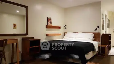 Cozy bedroom with modern wooden furniture and ambient lighting, perfect for relaxation and comfort.