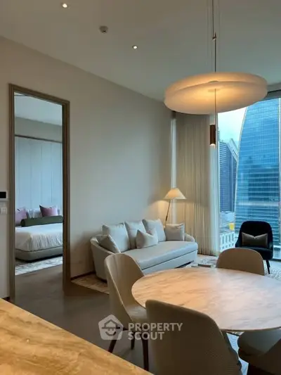 Modern living room with city view and elegant dining area