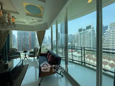 Luxurious living room with floor-to-ceiling windows offering stunning city views and elegant decor.