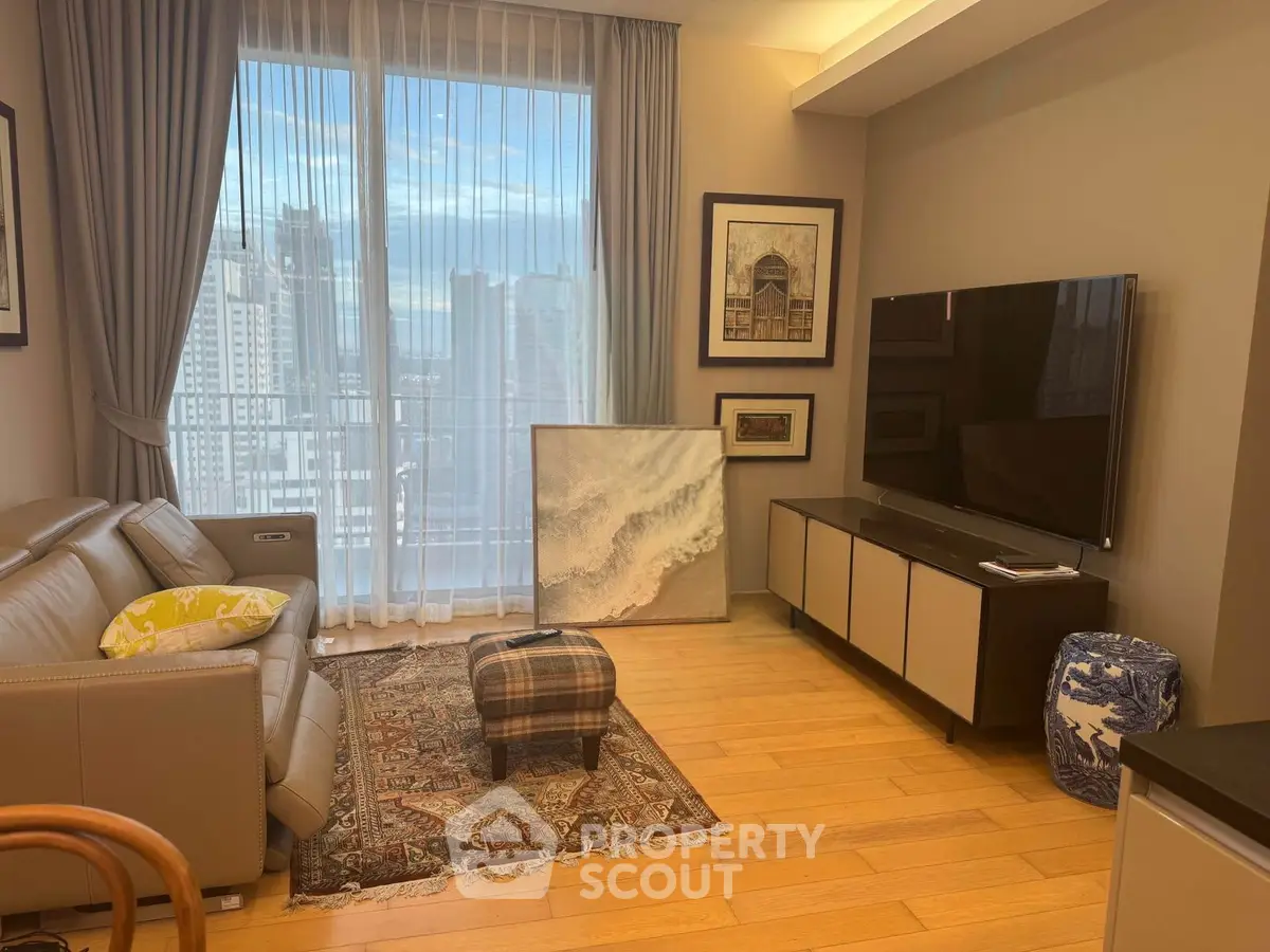 Stylish living room with city view, modern furniture, and elegant decor in a high-rise apartment.