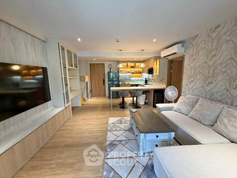 Spacious modern living room with open kitchen and stylish decor